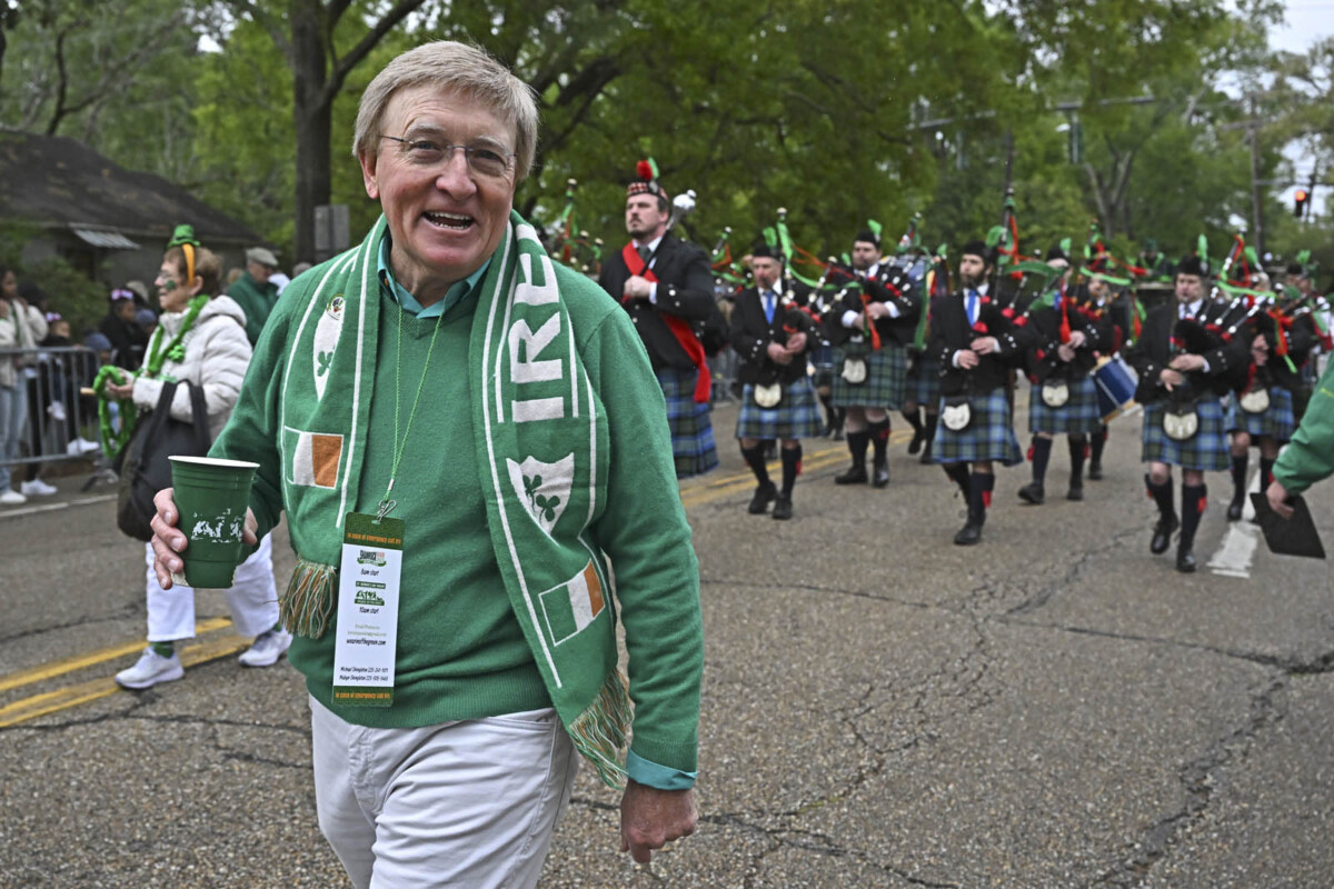 Pat Shingleton, founder of the Wearin' of the Green parade, leads a band of bagpipers through the parade route