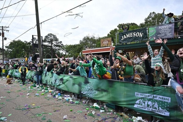 Excited crowds catch beads during the 2023 St. Patricks day parade
